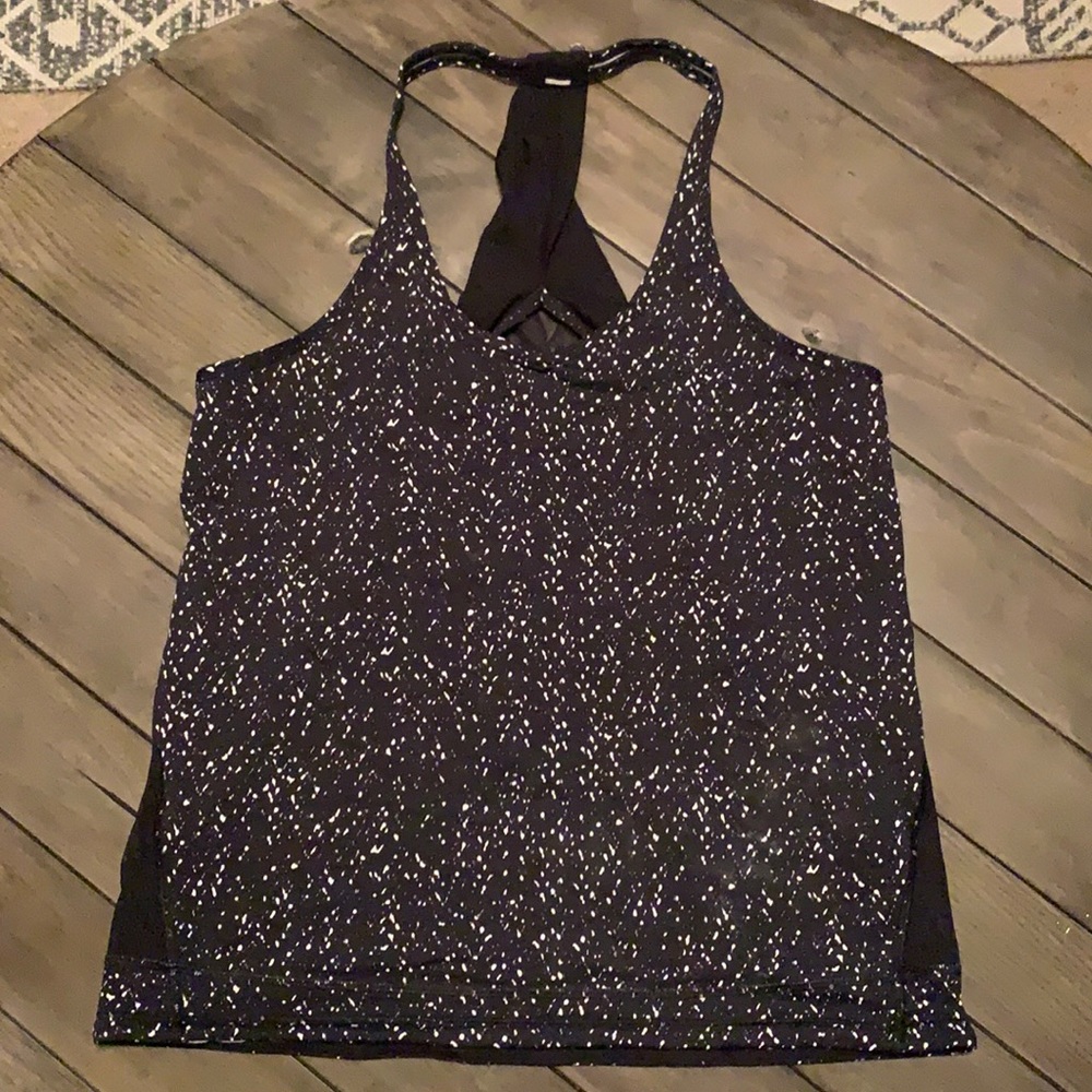 Lululemon tank top. Mesh back. Drawstring hem.